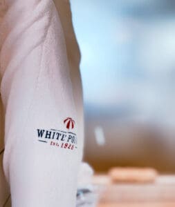 A white robe hanging on a hook at the Nova Scotia beach resort, White Point